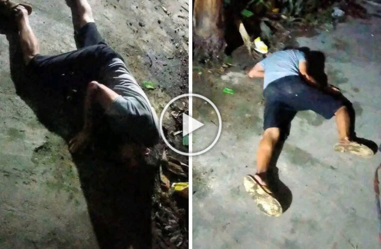 Cận cảnh ông bố say riệu nằm đường